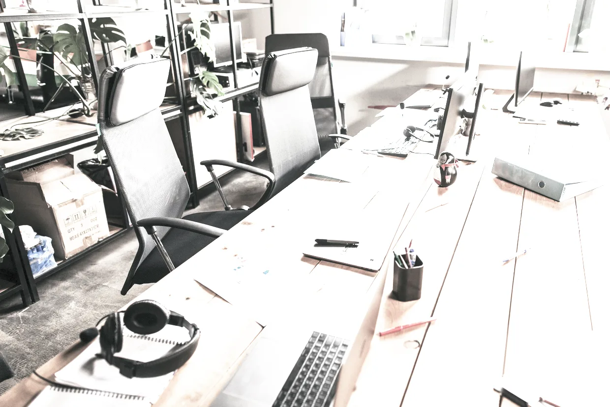 The Balsworth office — a plain room with desks, printed accounts and even daylight